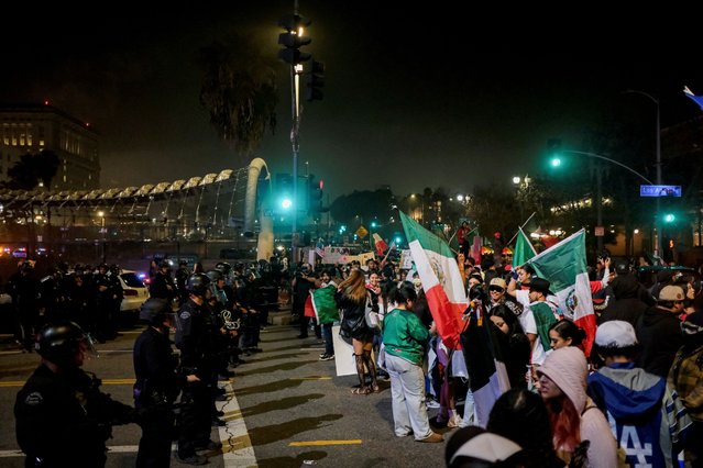 LAPD officers block off street access during a protest against arrests and deportations of migrants by U.S. government agencies in Los Angeles, California, U.S. February 2, 2025. (Photo by Joel Angel Juarez/Reuters)