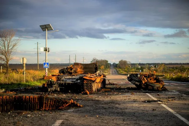 Remains of a destroyed Russian tank are scattered on the ground along the road between Izium and Kharkiv, Ukraine, Monday, October 3, 2022. (Photo by Francisco Seco/AP Photo)