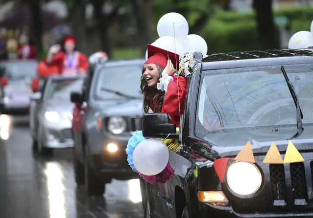 Westmont Hilltop High School graduate Chloe Whorl is shown riding in the parade in lieu of a commencement ceremony in Johnstown, Pa., Friday, May 29, 2020. (Photo by John Rucosky/Tribune-Democrat via AP Photo)