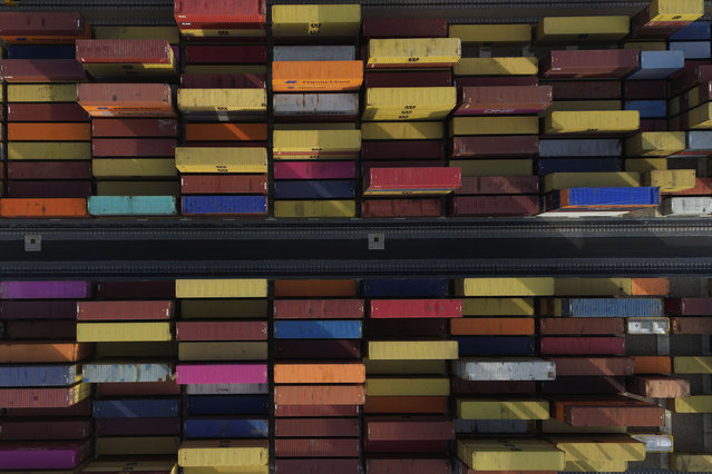 Shipping containers wait to be processed at London Gateway port, in Stanford-le-Hope, on the Thames estuary east of London, England, Wednesday, February 5, 2025. (Photo by AP Photo)