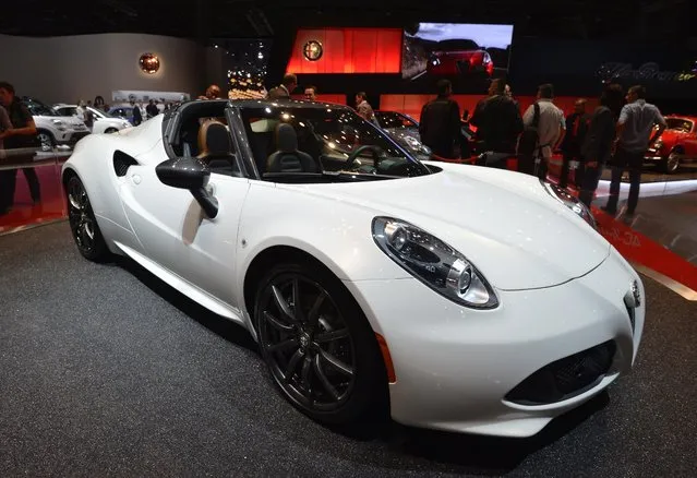 The Alfa Romeo 4C Spider is presented at the 2014 Paris Auto Show on October 2, 2014 in Paris, on the first of the two press days. (Photo by Miguel Medina/AFP Photo)