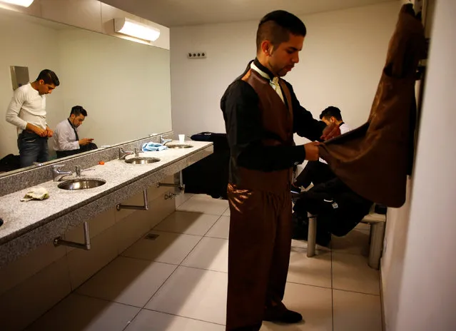 Contestants prepare backstage during the Salon Tango style qualifier round at the Tango World Championship in Buenos Aires, Argentina, August 22, 2016. (Photo by Enrique Marcarian/Reuters)