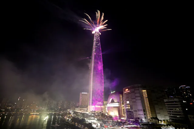 Fireworks explode over Lotte Group's 123-storey skyscraper Lotte World Tower as it is illuminated during New Year celebration in Seoul, South Korea, January 1, 2018.  (Photo by Kim Hong-Ji/Reuters)