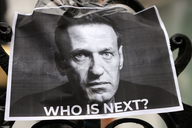 A picture of late Russian opposition leader Alexei Navalny is attached to a fence outside the Russian Embassy, in London, Britain on February 17, 2024. (Photo by Hollie Adams/Reuters)