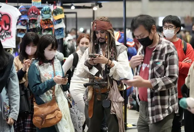 A cosplayer dressed as Jack Sparrow character looks at his smartphone during the Tokyo Comic Con 2022 at Makuhari Messe in Chiba, Japan, 25 November 2022. For the first time since 2019, the three-day long convention will be opened to the public until 27 November. (Photo by Franck Robichon/EPA/EFE/Rex Features/Shutterstock)