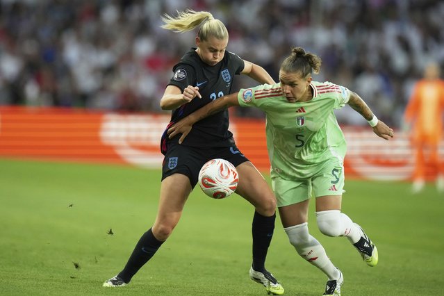 Italy's Elena Linari vies for the ball with England's Alessia Russo, left, during the Women's Euro 2025 semifinals soccer match between England and Italy at Stade de Geneve in Geneva, Switzerland, Tuesday, July 22, 2025. (Photo by Alessandra Tarantino/AP Photo)