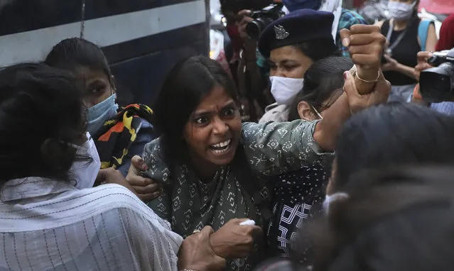 A woman reacts as police detain activists protesting against gang rape and killing of a woman in India's northern state of Uttar Pradesh during a protest in New Delhi, India, Thursday, October 1, 2020. (Photo by Manish Swarup/AP Photo)