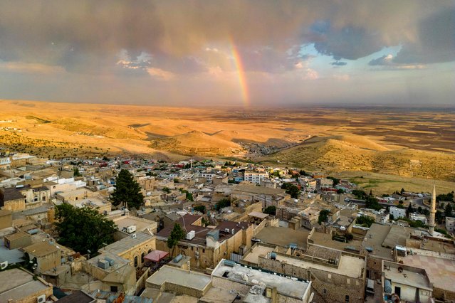 This aerial general view shows the old Midyat town in Mardin province, southeastern Turkey, on July 1, 2024. Archaeologists stumbled upon the city-under-a-city “almost by chance” after an excavation of house cellars in the city of Midyat led to the discovery of a vast cave system in 2020. (Photo by Yasin Akgul/AFP Photo)