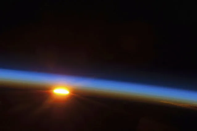 The sun about to come up over the South Pacific Ocean, taken from aboard the International Space Station a few hundred miles east of Easter Island on May 9, 2013. (Photo by Reuters/NASA)