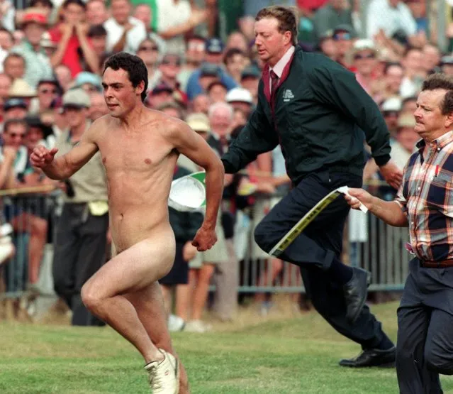  A streaker is chased across the 18th green by course officials just prior to the end of the 125th British Open golf championship at the Royal Lytham and St. Annes G.C. northwest England, Sunday  July 21, 1996. US golfer Tom Lehman won the tournament. (Photo by Dave Caulkin/AP Photo)