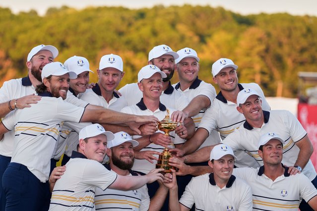 Europe poses with the trophy after winning the Ryder Cup golf tournament against the United States on the Bethpage Black golf course, Sunday, September 28, 2025, in Farmingdale, N.Y. (Photo by Lindsey Wasson/AP Photo)