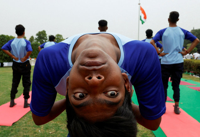 A participant performs yoga during International Yoga Day at Purana Qila, or Old Fort in New Delhi, India on June 21, 2024. (Photo by Priyanshu Singh/Reuters)