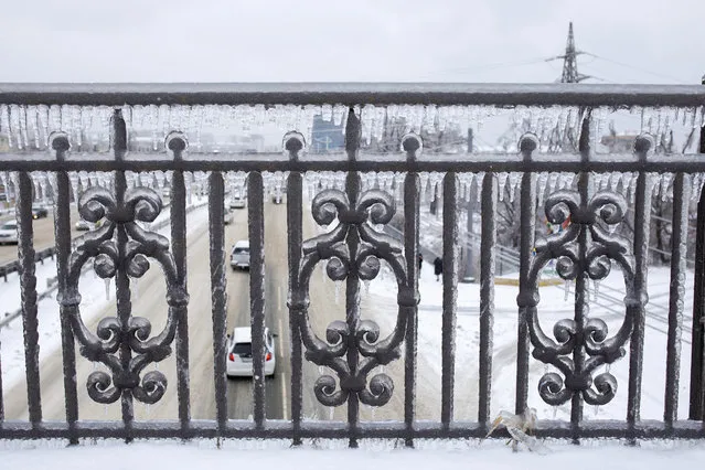 A railing covered in ice after an ice storm, on a street in Vladivostok, Russia, Friday, November 20, 2020. (Photo by Aleksander Khitrov/AP Photo)