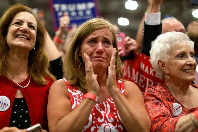 A woman is moved to tears as Republican U.S. presidential nominee Donald Trump takes the stage at a campaign rally in Newtown, Pennsylvania, U.S. October 21, 2016. (Photo by Jonathan Ernst/Reuters)