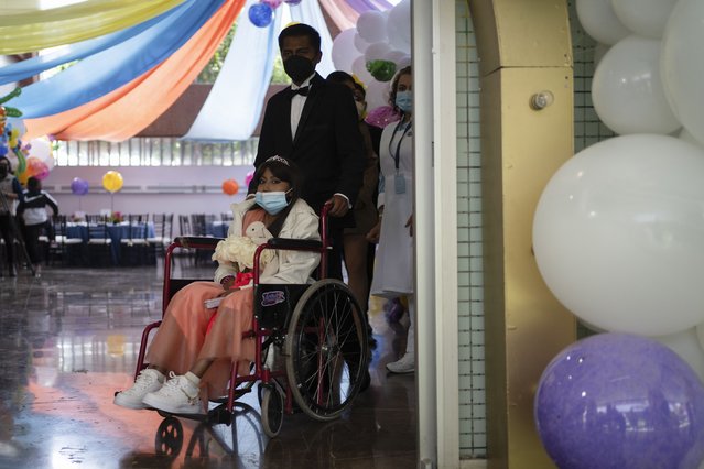Karla Valerye, 15, and her “chamberlain” or escort, arrive to the annual “Mis XV” or “My Fifteenth” birthday celebration for patients who are currently in treatment for a serious disease or have overcome cancer, at the Federico Gomez Children's Hospital in Mexico City, Friday, August 9, 2024. (Photo by Aurea Del Rosario/AP Photo)