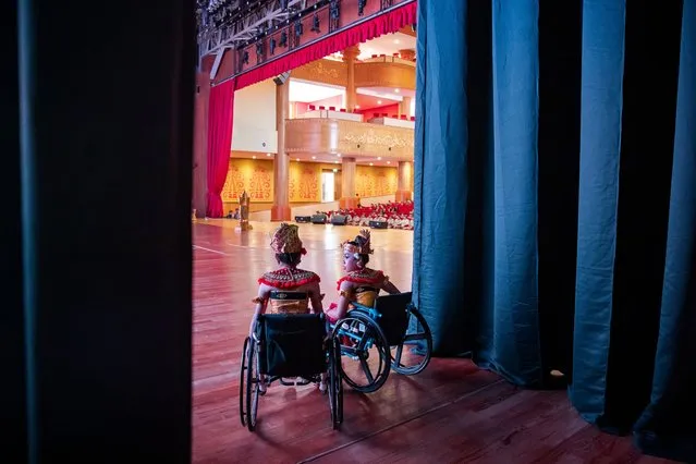 Balinese dancers with disabilities Wayan Sonia (L) and Yulia Widyantari (R) wait backstage before performing in Denpasar, Bali, Indonesia, 12 May 2023. Yulia Widyantari and Wayan Sonia, who both have had a passion for dancing since childhood and have dreamt of becoming professional dancers, were performing a traditional dance called 'Tari Margapati' in front of hundreds of spectators. In Bali, there are approximately 12,086 residents with disabilities recorded. (Photo by Made Nagi/EPA/EFE/Rex Features/Shutterstock)