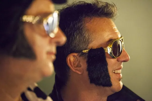 Paul Brownlow (R) hangs out backstage during the 20th annual Seattle Invitationals, an amateur Elvis impersonator competition, in Seattle, Washington January 23, 2015. (Photo by David Ryder/Reuters)