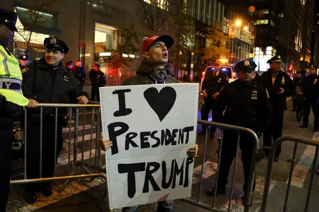 A supporter of President-elect Donald Trump shouts back at opposing demonstrators during a protest against the President-elect in Manhattan, New York, U.S., November 11, 2016. (Photo by Bria Webb/Reuters)