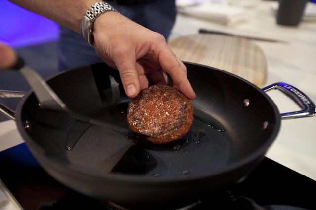 In this handout image provided by Ogilvy, a burger made from cultured beef, which has been developed by Professor Mark Post of Maastricht University in the Netherlands, is prepared at the world's first public tasting of the product on August 5, 2013 in London, England. Cultured Beef could help solve the coming food crisis and combat climate change with commercial production of Cultured Beef beginning within ten to twenty years. (Photo by David Parry via Getty Images)
