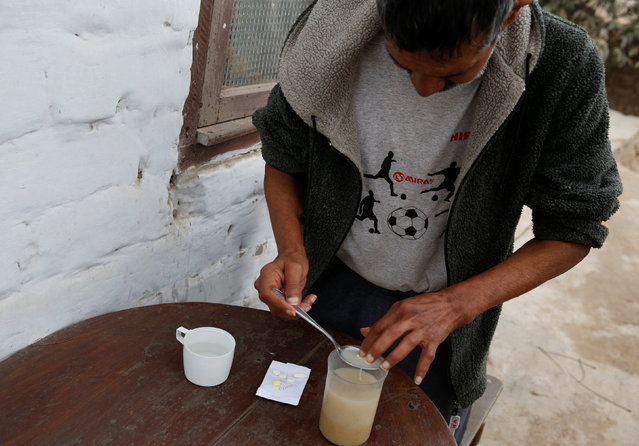Orlando Lajo, 54, receives  medicine for multidrug-resistant tuberculosis at a homeless shelter in Carabayllo in Lima, Peru July 14, 2016. (Photo by Mariana Bazo/Reuters)
