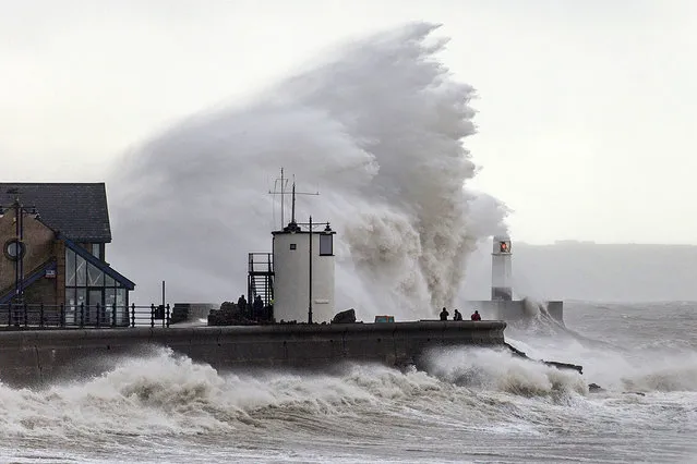 Huge waves batter the seafront at Porthcawl in Wales, UK during high tides and severe winds on August 20, 2016. (Photo by Tim Bow/Apex News)