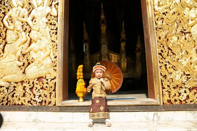 A girl wearing a traditional dress poses for a photo in a temple during the Songkran Festival or the Lao New Year in Luang Prabang, Laos, April 15, 2021. (Photo by Xinhua News Agency/Rex Features/Shutterstock)