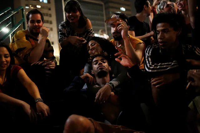 Members of lesbian, gay, bisexual and transgender (LGBT) community, that have been invited to live in a building that the roofless movement has occupied, spend time at Franklin Roosevelt Square in downtown Sao Paulo, Brazil, November 26, 2016. (Photo by Nacho Doce/Reuters)