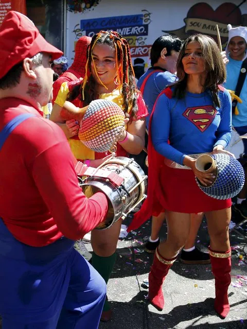 A reveller dressed as video game character “Mario” (L) takes part in the “Desliga da Justica” carnival parade during pre-carnival festivities in Rio de Janeiro, Brazil, January 23, 2016. (Photo by Sergio Moraes/Reuters)