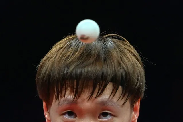 China's Wang Manyu hits a return against Japan's Miwa Harimoto in their women's team final table tennis match during the Hangzhou 2022 Asian Games in Hangzhou, in China's eastern Zhejiang province on September 26, 2023. (Photo by Ishara S. Kodikara/AFP Photo)