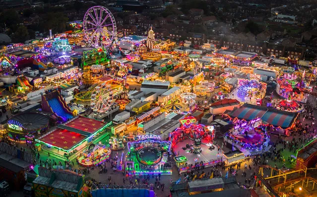 A general view on Monday, October 9, 2023 of the Hull Fair 2023 in Yorkshire, one of the largest travelling fairs in Europe, which features over 250 rides. The fair features an array of rides alongside traditional attractions such as palm reading and stalls packed with food, treats and games. (Photo by Danny Lawson/PA Images via Getty Images)