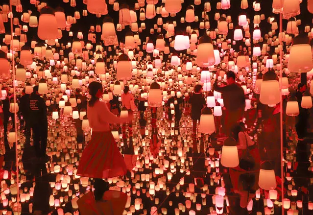Visitors enjoy visionary digital art installation by Japan’s digital art collective company “teamLab” in Tokyo, Japan on November 28, 2018. The digital art museum celebrated the museum’s 1 millionth guest, only 150 days after the museum opened at Tokyo’s waterfront in June. (Photo by Aflo/Rex Features/Shutterstock)