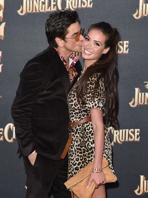 American actor John Stamos and American actress Caitlin McHugh attend the World Premiere of Disney's “Jungle Cruise” at Disneyland on July 24, 2021 in Anaheim, California. (Photo by Axelle/Bauer-Griffin/FilmMagic)
