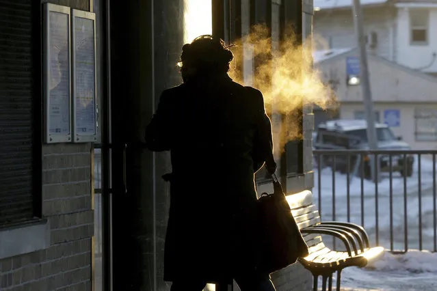 A commuter arrives at Metra Western Avenue station, Tuesday, January 29, 2019, in Chicago. Forecasters warn that the frigid weather Tuesday will get worse and could be life-threatening. (Photo by Kiichiro Sato/AP Photo)