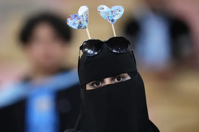 A Manchester City fan attends the trophy ceremony after the end of the Soccer Club World Cup final match between Manchester City FC and Fluminense FC at King Abdullah Sports City Stadium in Jeddah, Saudi Arabia, Friday, December 22, 2023. Manchester City won 4-0. (Photo by Manu Fernandez/AP Photo)