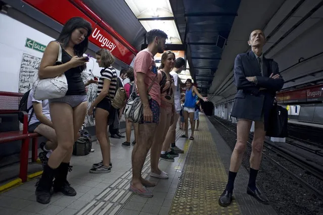 People taking part in the “No Pants Subway Ride” wait at a metro station in Buenos Aires on January 12, 2014. (Photo by Alejandro Pagni/AFP Photo)