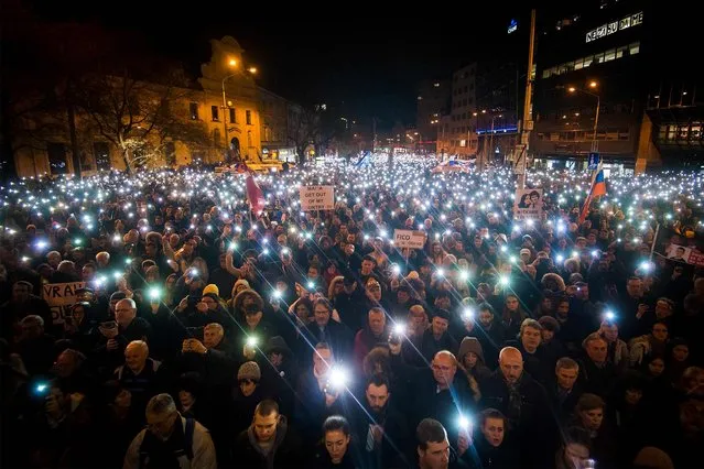 People attend a protest named “For a Decent Slovakia” on the first anniversary of the murder of journalist Jan Kuciak and his fiancee Martina Kusnirova on February 21, 2019 in Bratislava, Slovakia. Jan Kuciak was found shot dead with his fiancee Martina Kusnirova at the couple's home near Bratislava on February 21, 2018, plunging the country into crisis and sparking mass demonstrations. (Photo by Vladimir Simicek/AFP Photo)