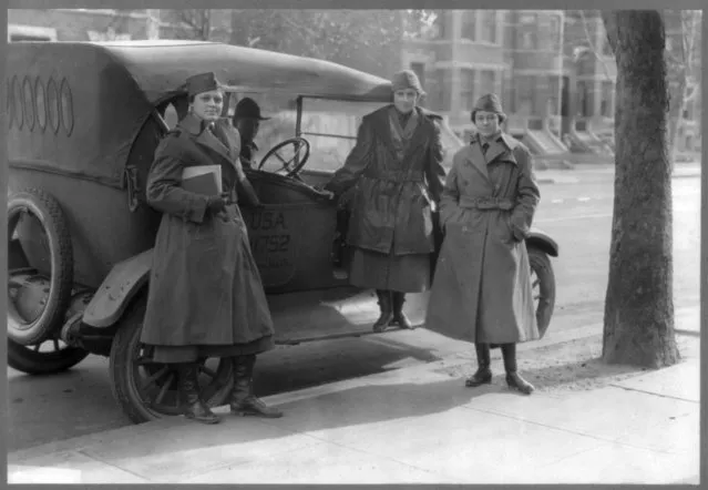 Members of The Women's Radio Corps stand beside an army car, circa February 1919, in this Library of Congress handout photo.. (Photo by Reuters/Bain Collection/Library of Congress)