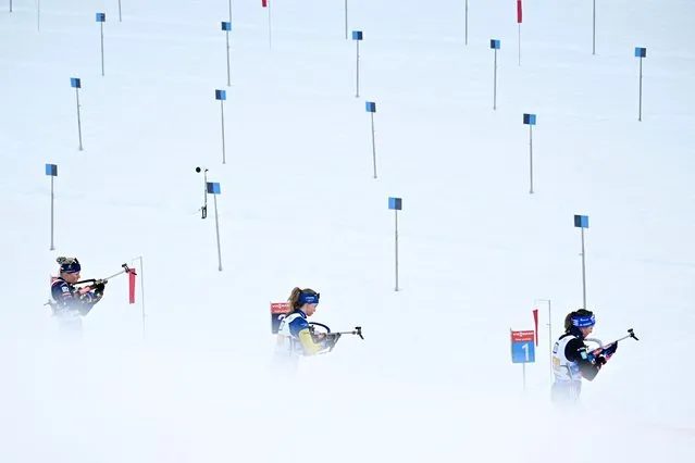 Biathletes compete at the shooting range during the women's 4x6km relay event of the IBU Biathlon World Cup in Ruhpolding, southern Germany on January 10, 2024. (Photo by Tobias Schwarz/AFP Photo)