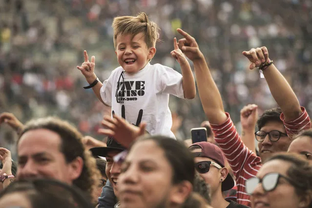 A youth attends the Vive Latino music festival in Mexico City, Sunday, March 17, 2019. The two-day rock festival is one of the most important and longest running of Mexico. (Photo by Christian Palma/AP Photo)