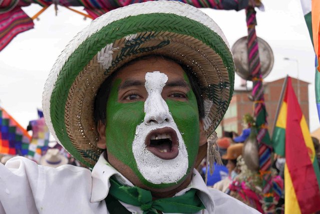 A government supporter shouts during a march to the capital coined “March for the homeland” in Caracollo, Bolivia, Tuesday, November 23, 2021. (Photo by Juan Karita/AP Photo)