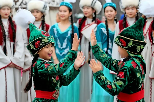 Young Kyrgyz girls wearing national costumes take part in the Nooruz celebrations in Bishkek, Kyrgyzstan, 21 March 2024. Nooruz, also called Nowruz, marks the first day of spring and is usually celebrated on 21 March every year. (Photo by Igor Kovalenko/EPA)
