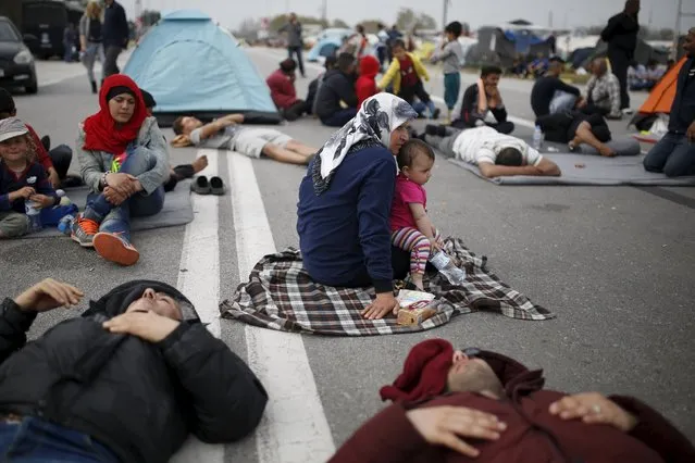 Migrants and refugees block the highway during a protest near the Greek-Macedonian border, near the town of Polykastro, Greece, April 2, 2016. (Photo by Marko Djurica/Reuters)