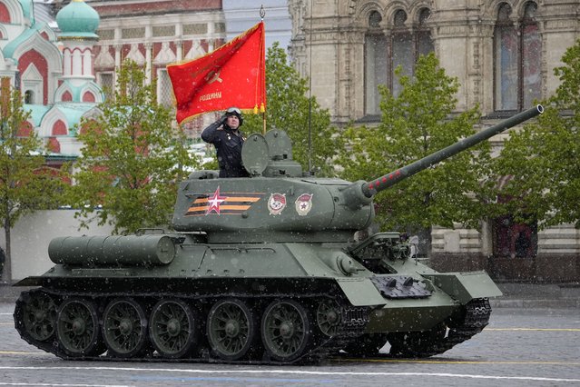 A legendary Soviet era T-34 tank with a red flag atop rolls during the Victory Day military parade in Moscow, Russia, Thursday, May 9, 2024, marking the 79th anniversary of the end of World War II. (Photo by Alexander Zemlianichenko/AP Photo)