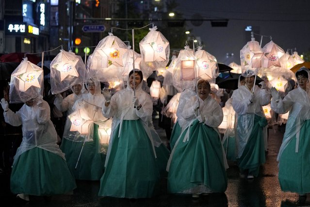 Buddhists carry lanterns and walk in a parade during the Lotus Lantern Festival, ahead of the birthday of Buddha at Dongguk University in Seoul, South Korea, Saturday, May 11, 2024. (Photo by Ahn Young-joon/AP Photo)