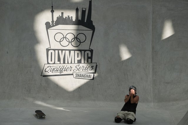 Brazil's Pedro Barros reacts after falling in the Skateboarding Men's Park Preliminaries for the 2024 Olympic Qualifier Series held in Shanghai, Friday, May 17, 2024. (Photo by Ng Han Guan/AP Photo)