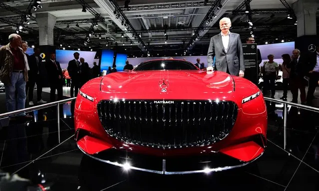 CEO of German carmaker Daimler and Mercedes-Benz Dieter Zetsche poses next to a “Vision Mercedes-Maybach 6” car before before the annual shareholders meeting in Berlin on March 29, 2017. (Photo by Tobias Schwarz/AFP Photo)