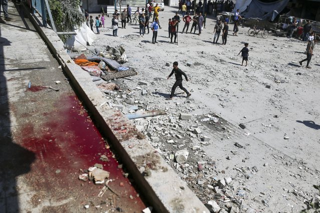 Blood can be seen in the aftermath of the Israeli strike on a U.N.-run school that killed dozens of Palestinians in the Nusseirat refugee camp in the Gaza Strip, Thursday, June 6, 2024. (Photo by Jehad Alshrafi/AP Photo)