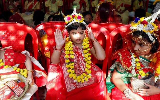 Girls dressed as Kumari attend rituals to celebrate the Navratri Festival, inside the Adyapeath Temple, on the outskirts of Kolkata, April 5, 2017. (Photo by Rupak De Chowdhuri/Reuters)