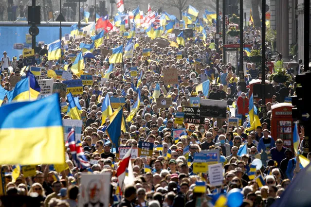 Demonstrators take part in the “London stands with Ukraine” solidarity march, called by Mayor of London Sadiq Khan, in London, Saturday, March 26, 2022. Organizers described the event as “an opportunity to send a unified message of support to the Ukrainian people”. (Photo by David Cliff/AP Photo)