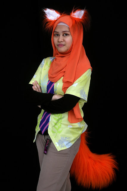 Nana, a young Malaysian Muslim cosplayer dressed as a character from Zootopia, poses during the “Hijab Cosplay” event in Subang Jaya, outside of Kuala Lumpur, on April 29, 2017. (Photo by Manan Vatsyayana/AFP Photo)